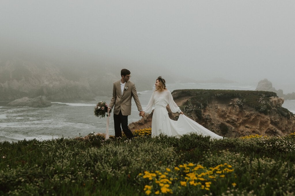 Madison + Kanyon Bride and groom walking in California at Garrapata State Park Elopement.