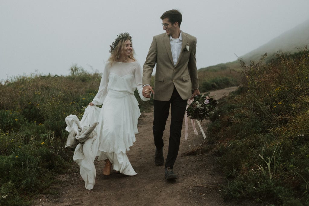 Madison + Kanyon Bride and groom end the day hand in hand at Garrapata State Park.