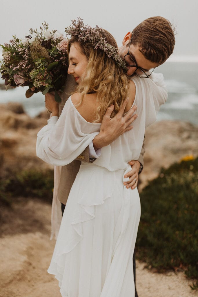 Madison + Kanyon bride and groom sharing an embrace during first looks.