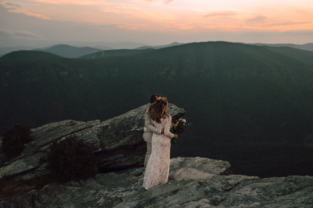 monica leavell photo linville gorge wilderness north carolina adventure elopement 048 newlyweds celebrate marriage on mountain.