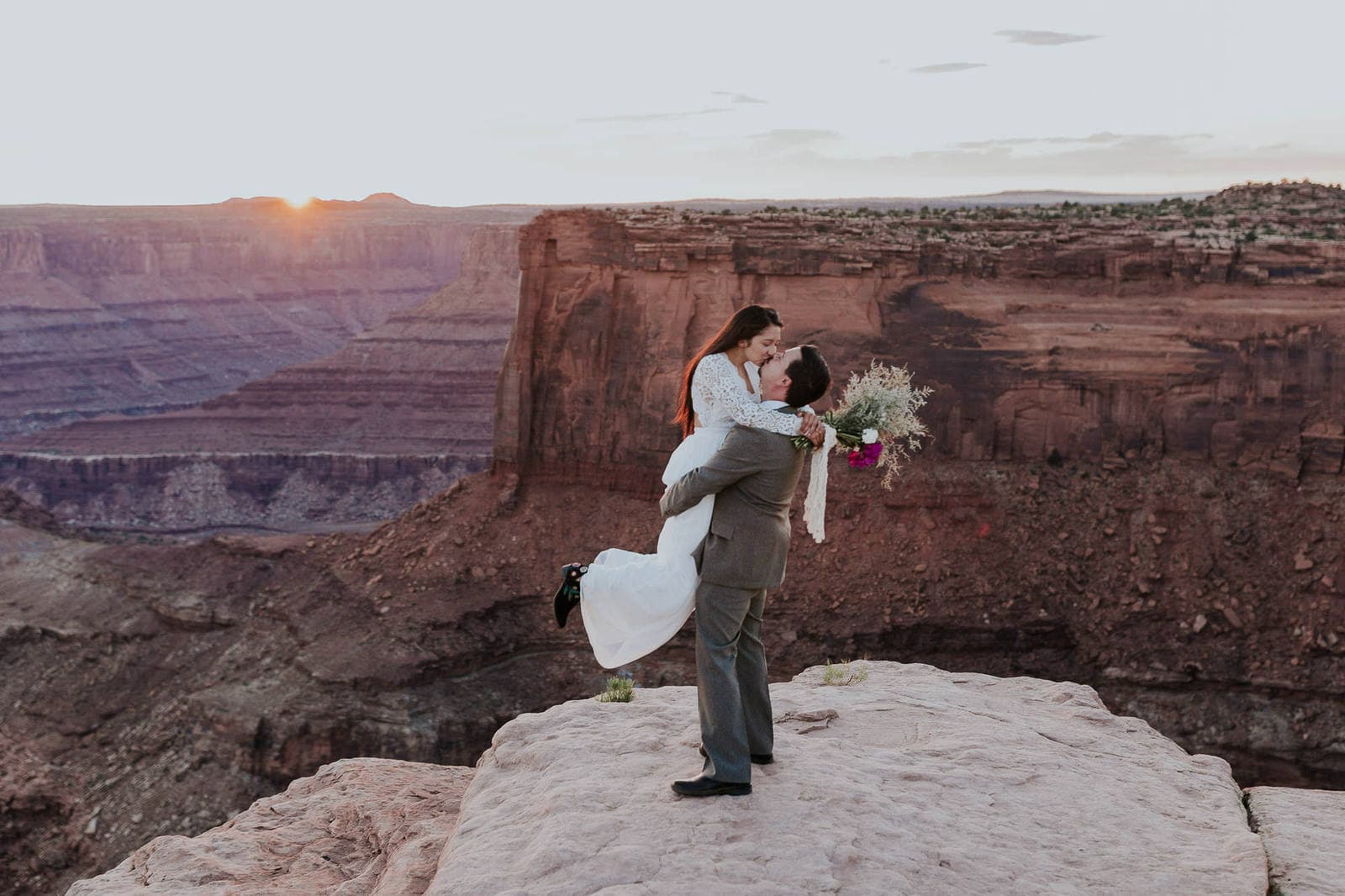 Couple celebrating marriage at Moab, Utah.