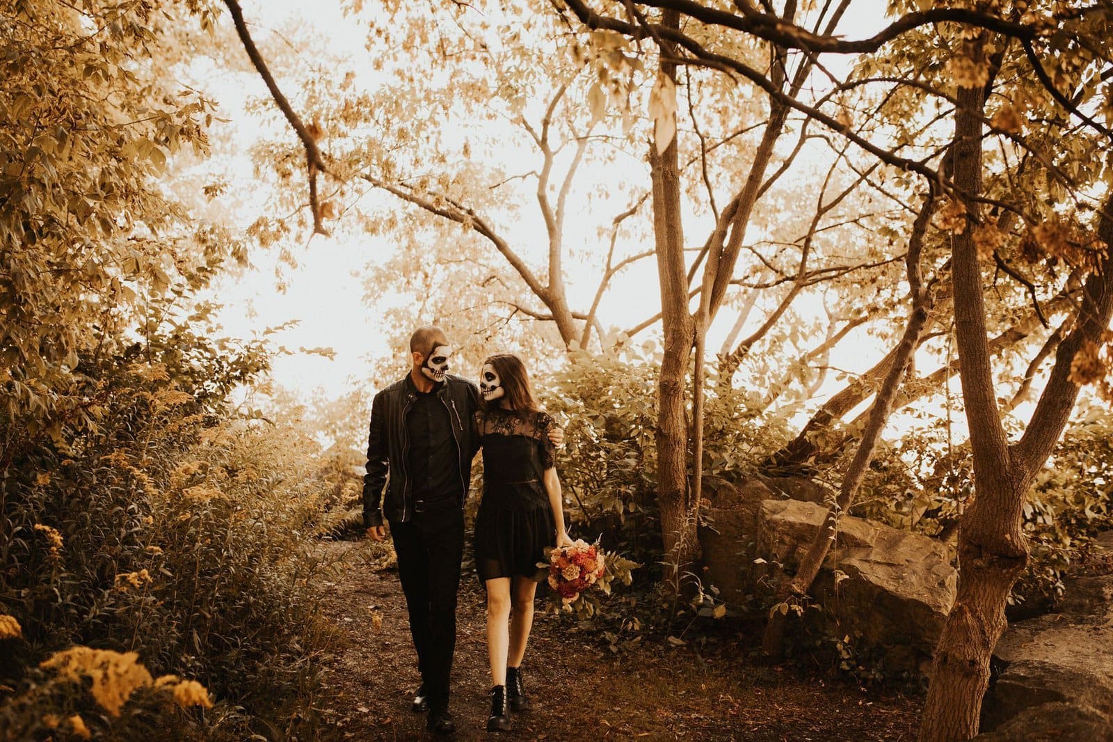 halloween couple walking hand in hand.