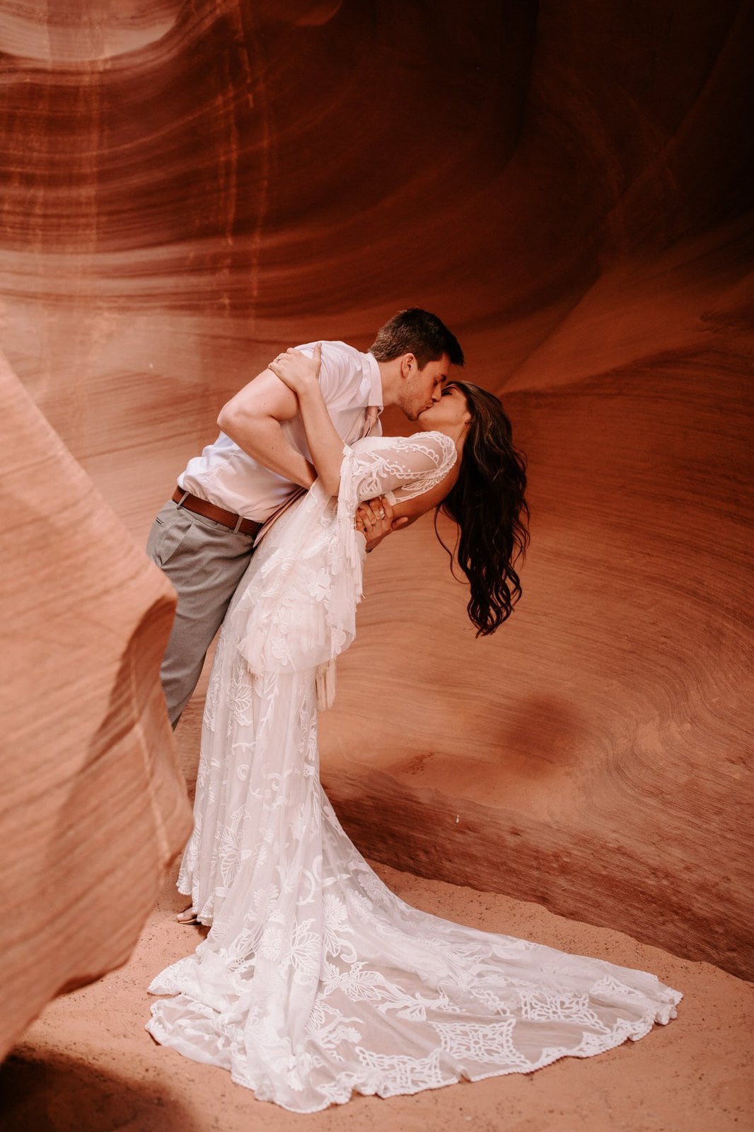 Savanna-Kaye-Horseshoe-Bend-Antelope-Canyon-Elopement_Arizona-3047 groom dips wife at Antelope canyon.