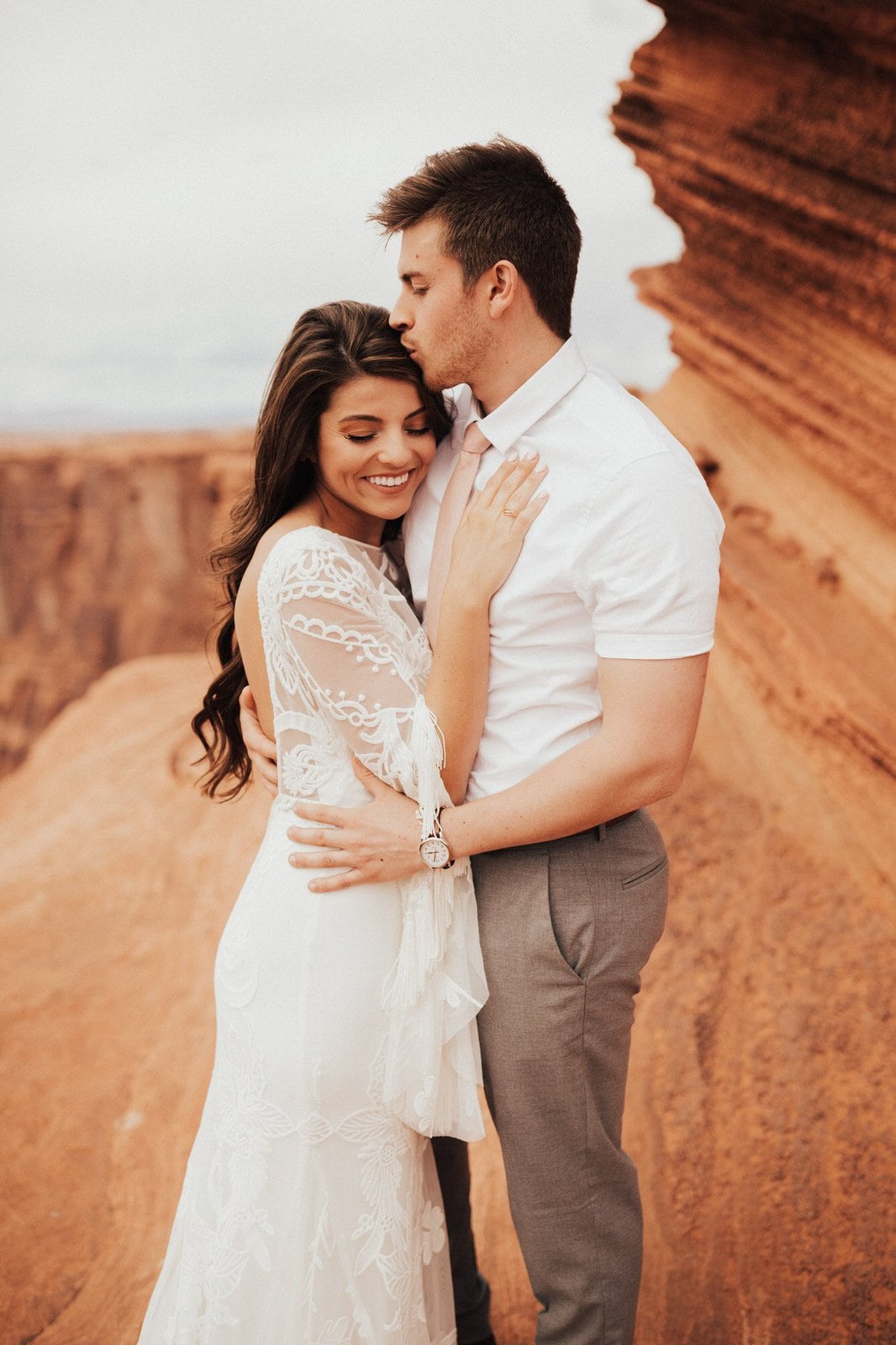 Savanna-Kaye-Horseshoe-Bend-Antelope-Canyon-Elopement_Arizona-4551 bride and groom embrace.
