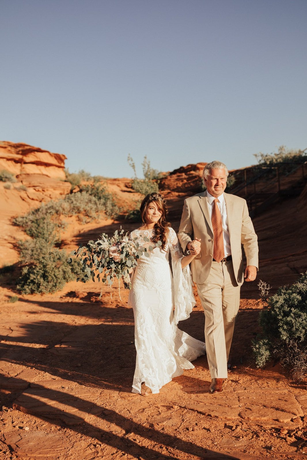 Savanna-Kaye-Horseshoe-Bend-Antelope-Canyon-Elopement_Arizona-6318 Bride and father walking down the aisle.