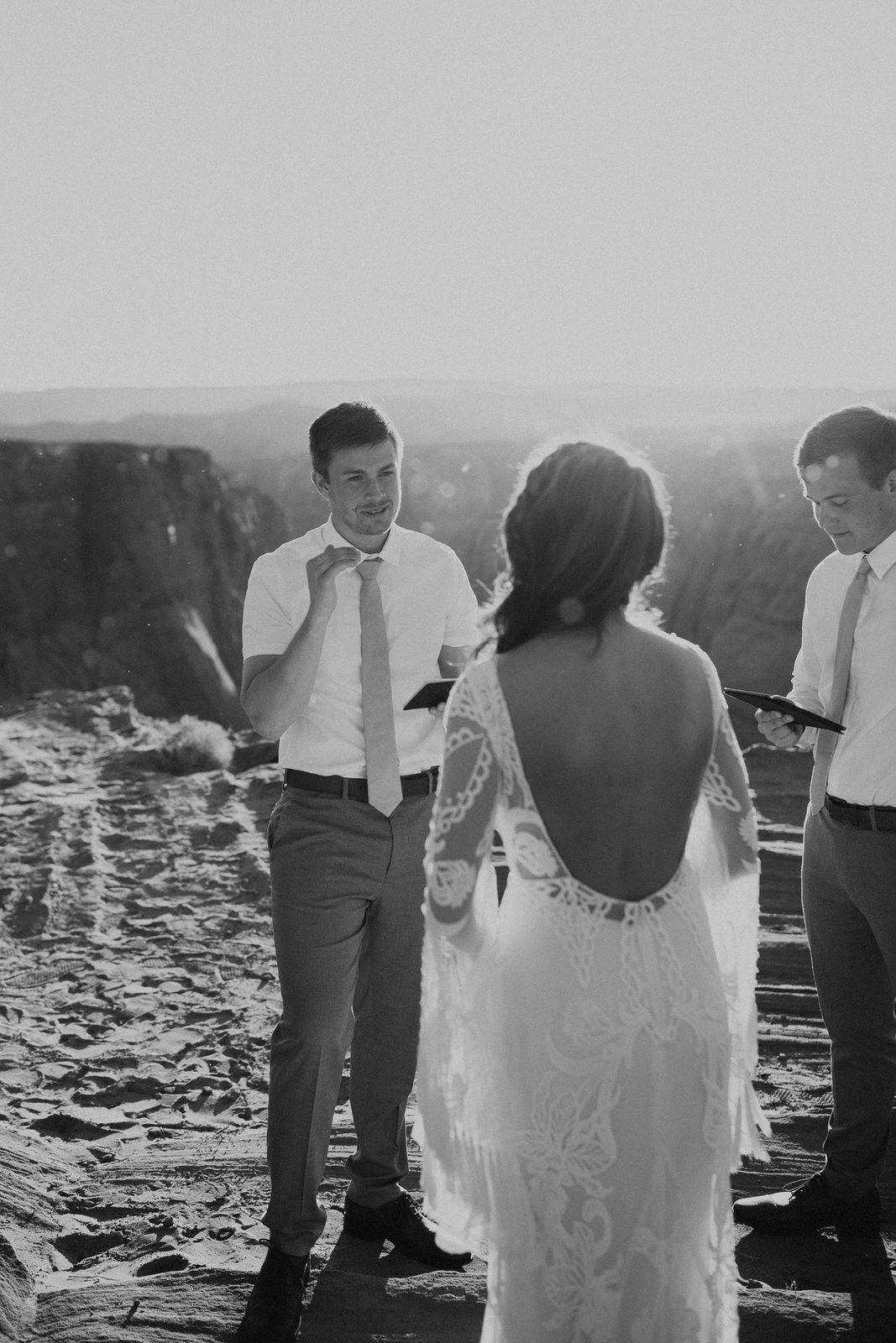 Savanna-Kaye-Horseshoe-Bend-Antelope-Canyon-Elopement_Arizona-6465 groom exchanging vows in Horseshoe Bend.