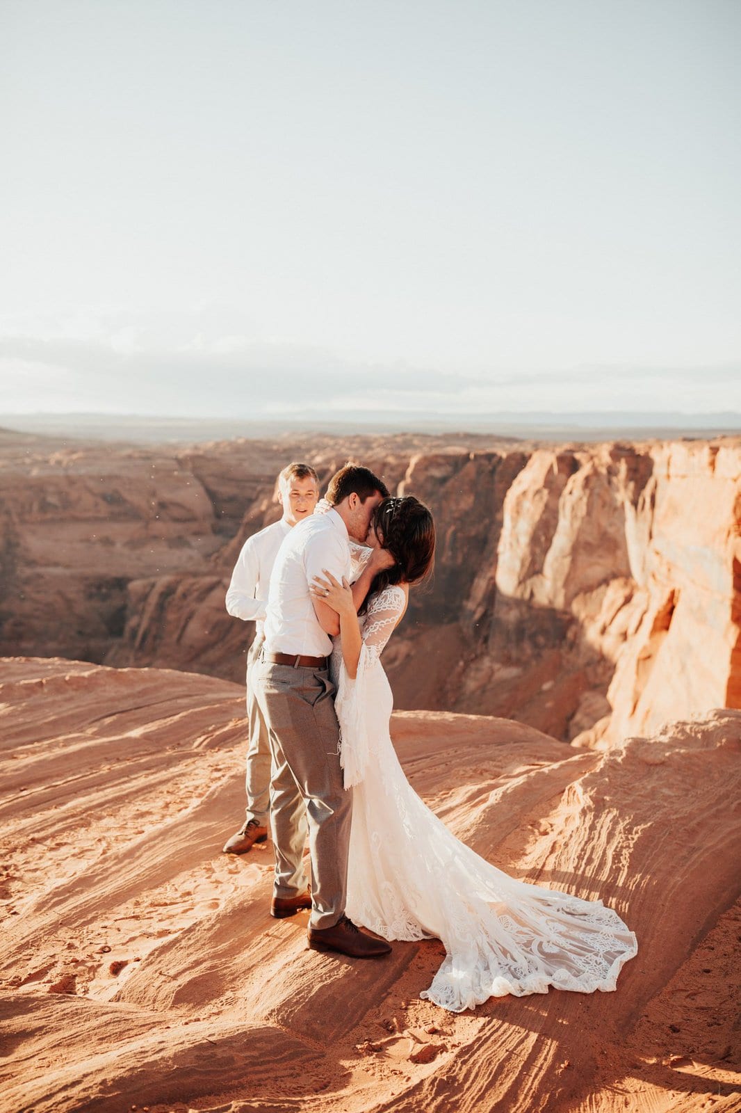 Savanna-Kaye-Horseshoe-Bend-Antelope-Canyon-Elopement_Arizona-6563 bride and groom share their first kiss at Horseshoe Bend.