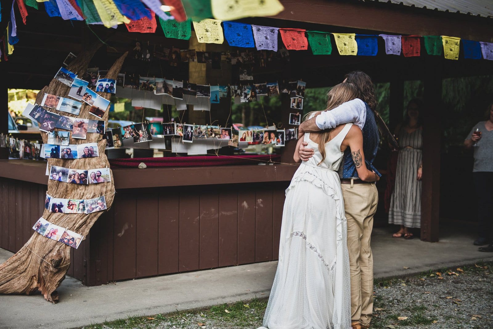 Bride and groom hug at reception.