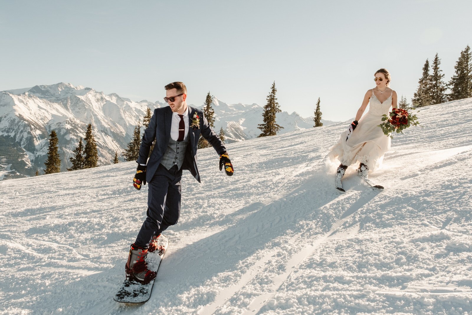 winter wedding photo ideas with couple skiing.