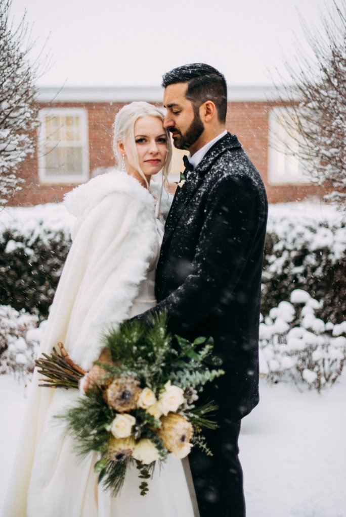 Bride and groom during winter wedding in the holidays.