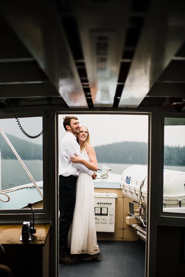 Sam-Starns-Intimate-wedding-and-adventure-elopements-first-dance Bride and groom dancing on a boat.