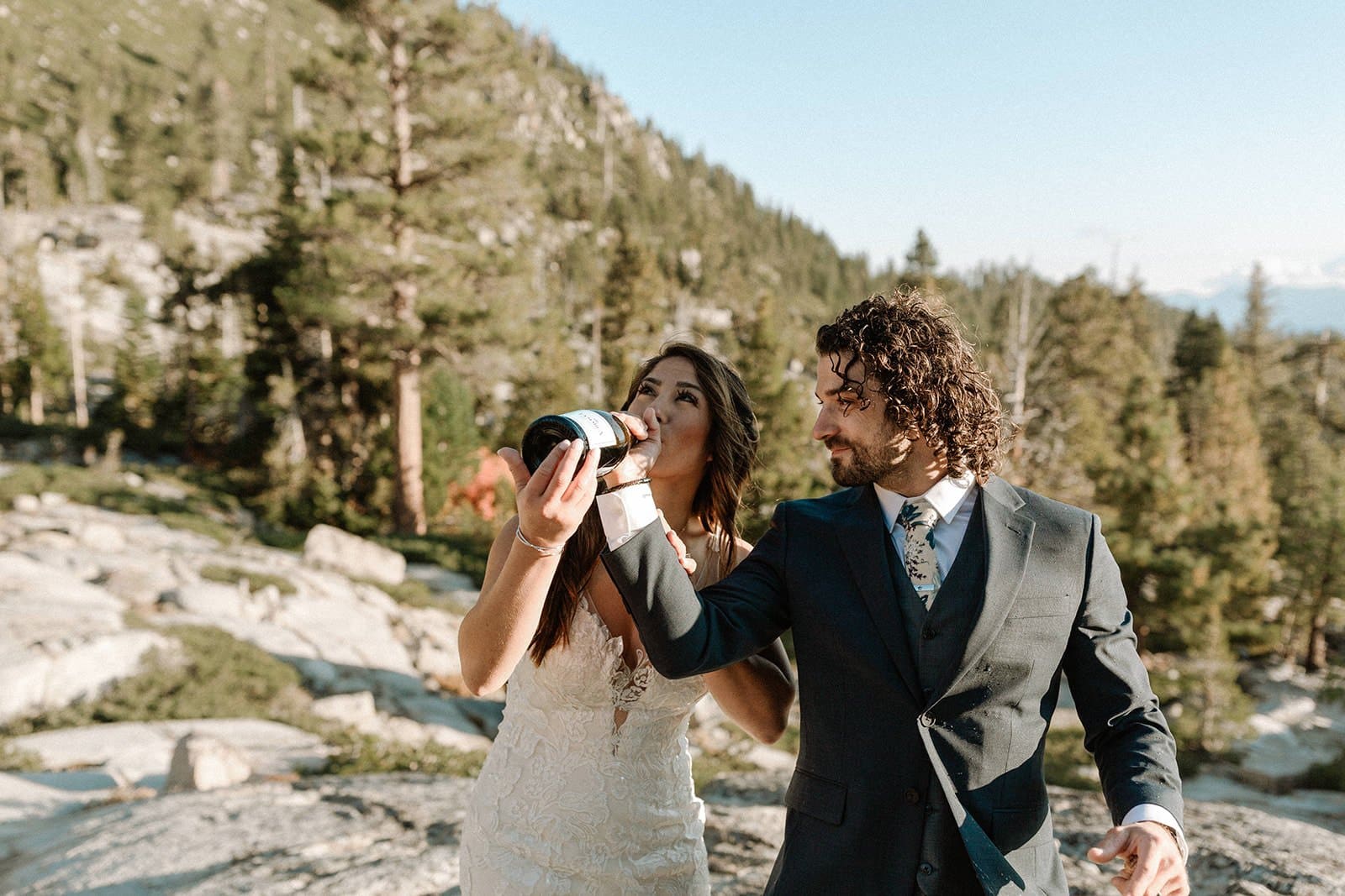 bride and groom drink champagne