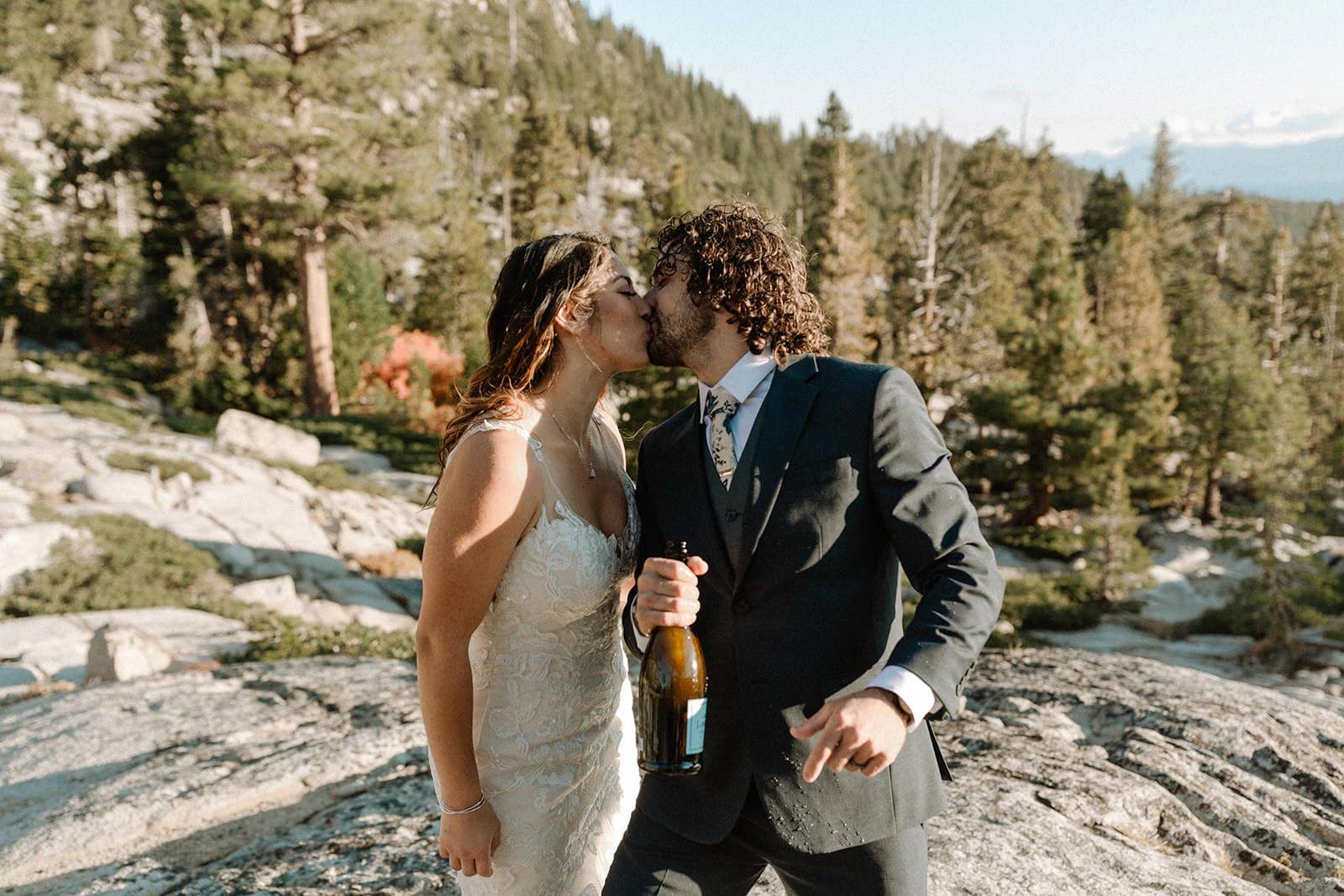 bride and groom share a kiss