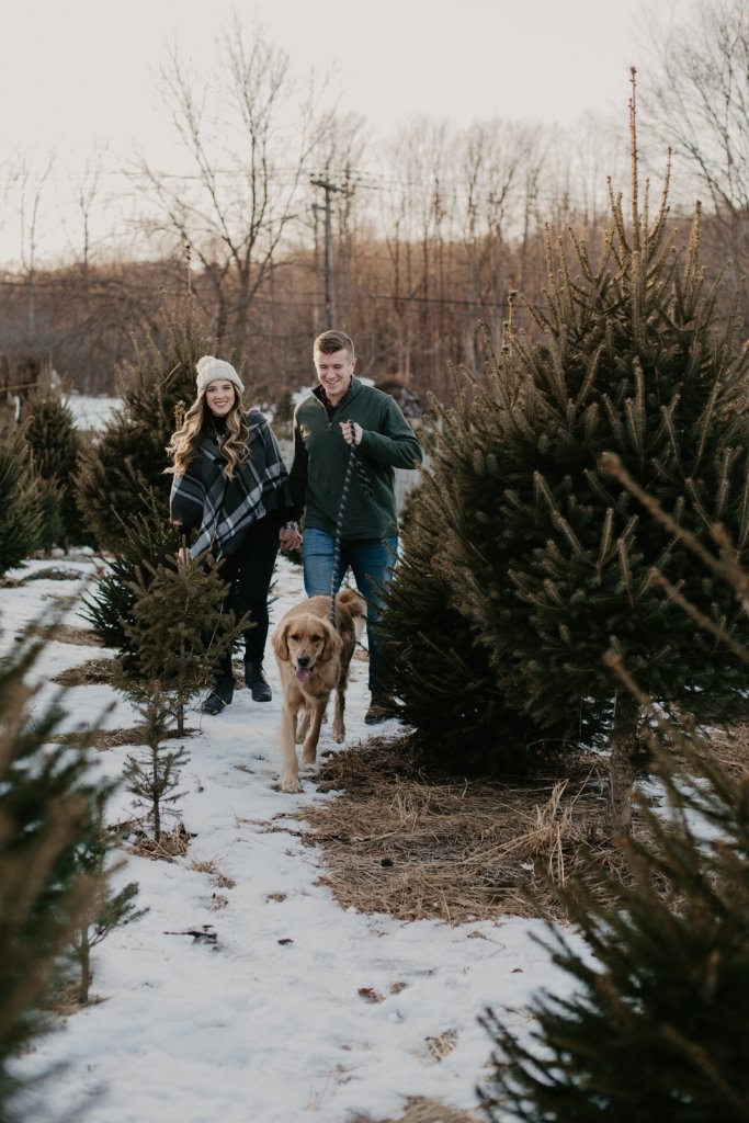 running through the snow with dog.