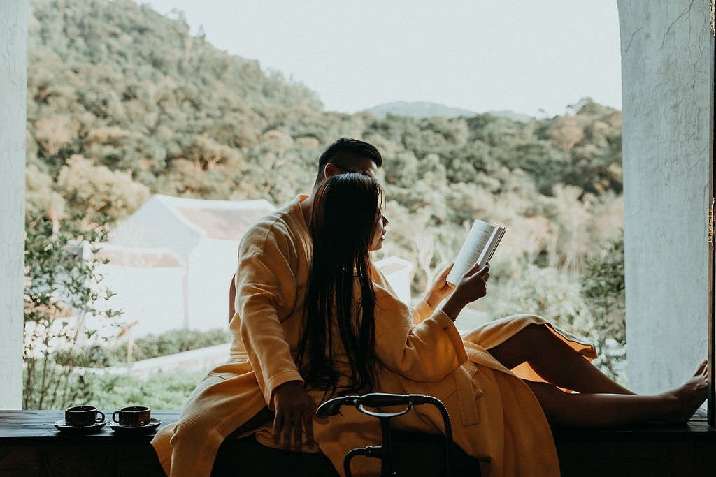 bride reading to her groom in Vietnam wedding