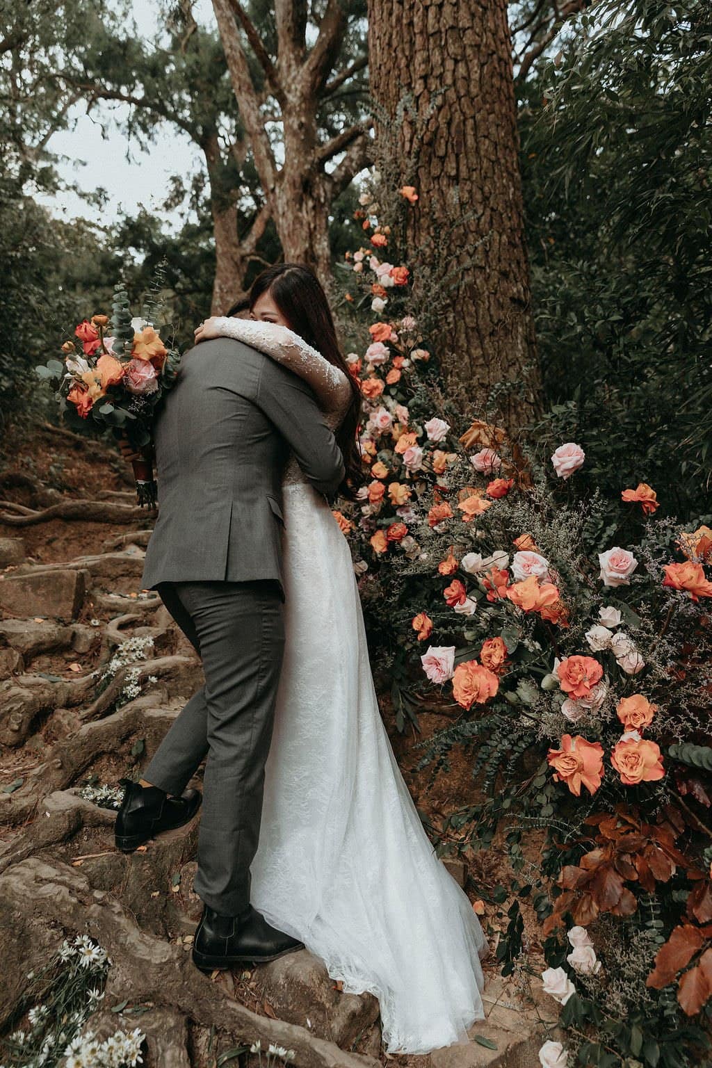 bride and groom embrace.