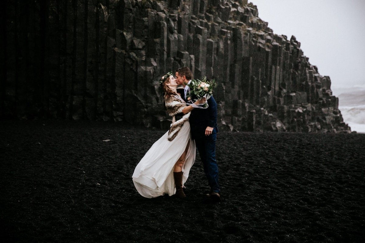 couple kissing after Reynisfjara Beach elopement