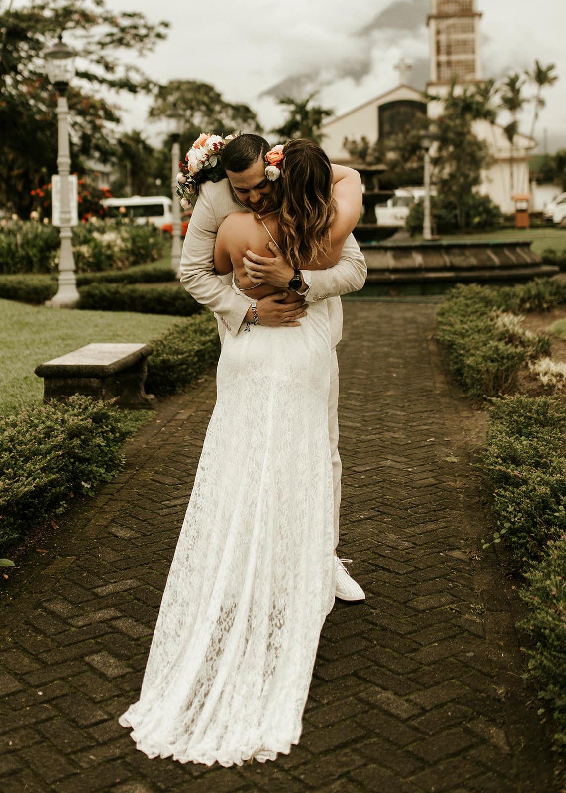 Jamie & Joey groom hugging his bride