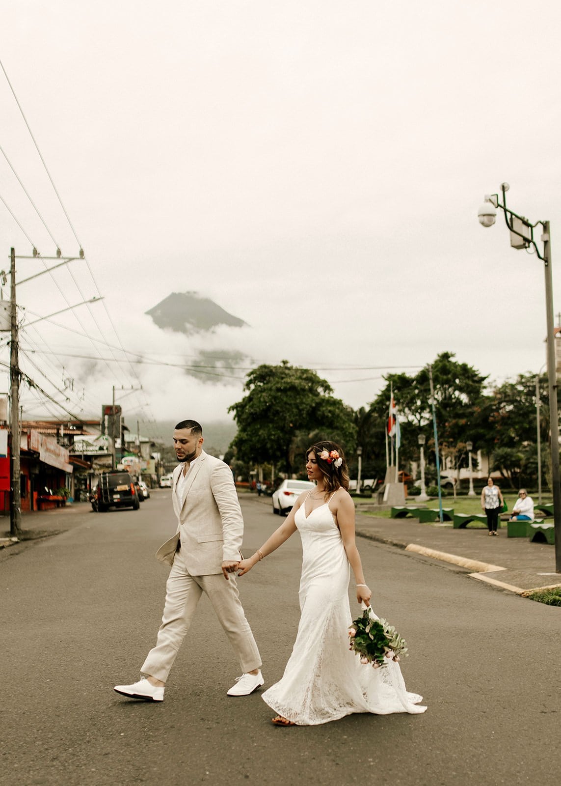 Jamie & Joey bride and groom walking in la fortuna