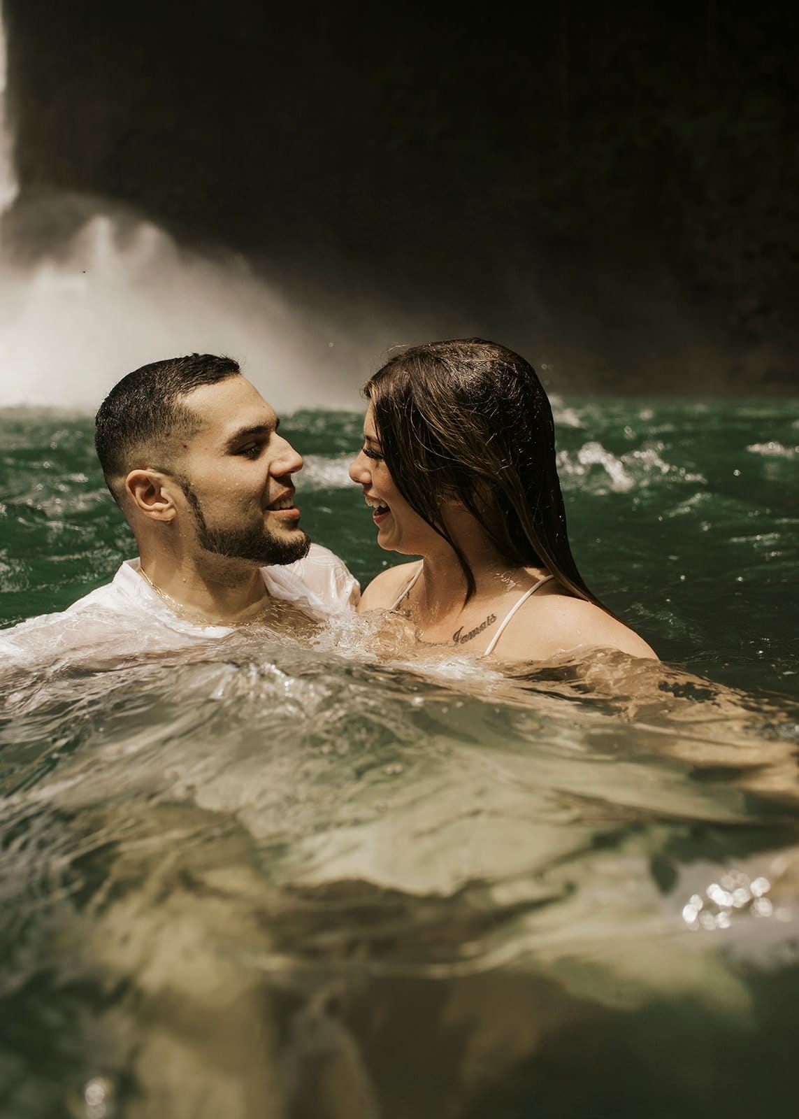 Jamie & Joey couple in water during costa rica waterfall elopement