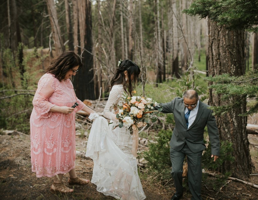 parents helping bride