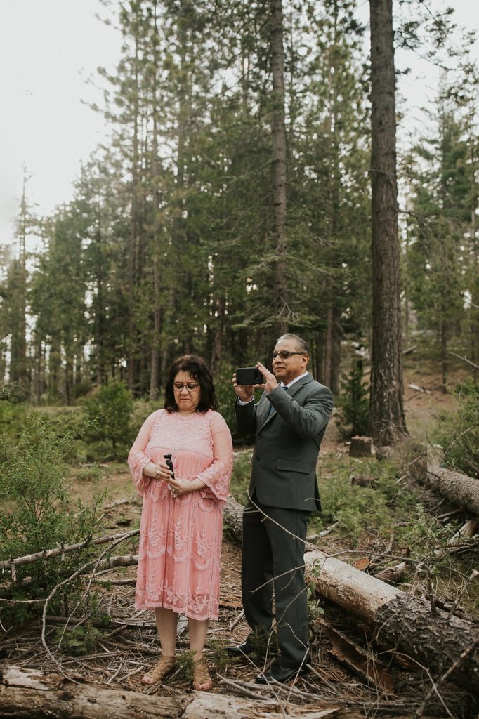 parents recording wedding