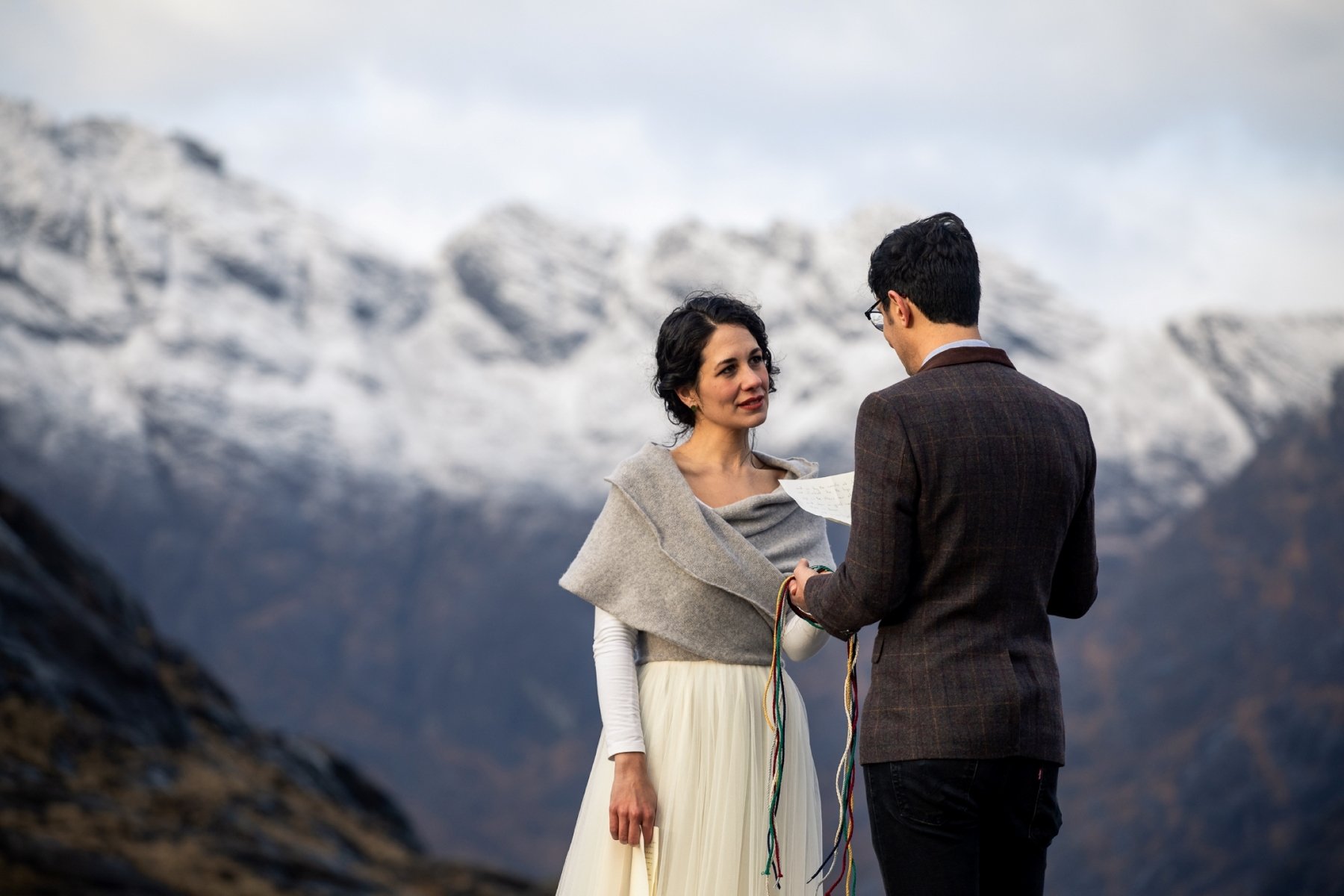 couple reading vows at scotland's isle of skye