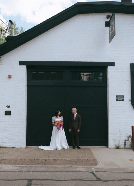 Downtown Providence eloping couple with colorful florals. Photo by Rhode Tripper Photography.