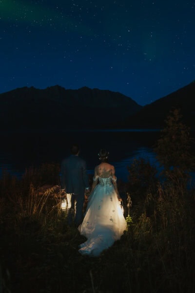 Elopement couple underneath norther lights in Norway