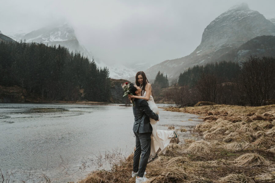 Elopement couple embracing the rain in Lofoten