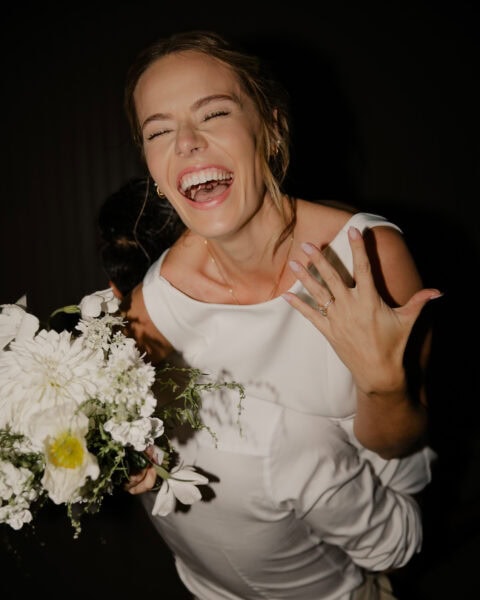 Bride shows off her ring after eloping at the oregon coast