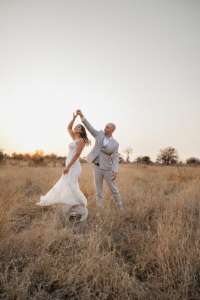 Bride and Groom dance during golden hour during their safari elopement in South Africa.